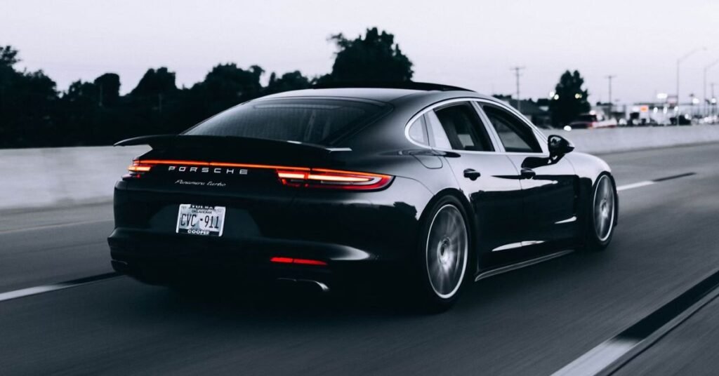 black porsche panamera turbo roller shot on a highway in oklahoma plates