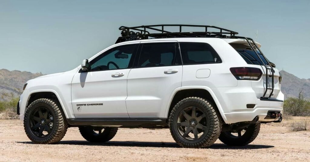 lifted white jeep grand cherokee off road desert driving
