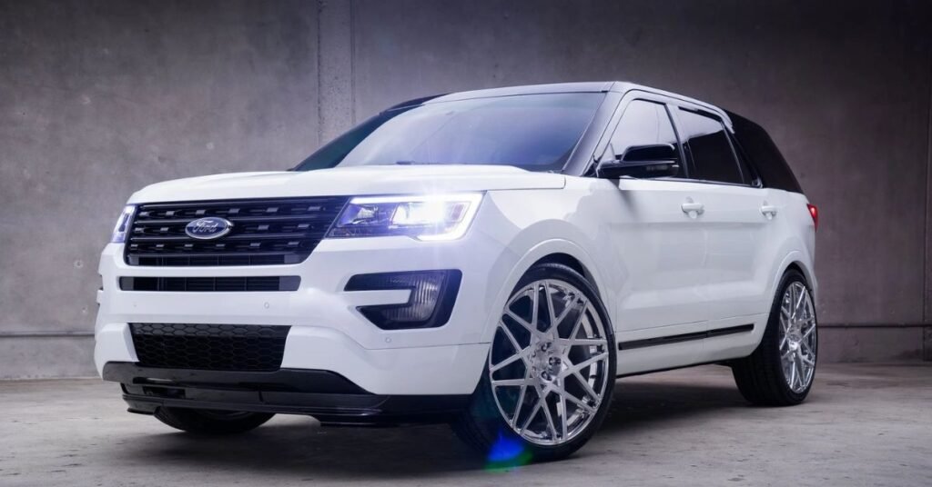 white ford explorer tuned with big silver rims